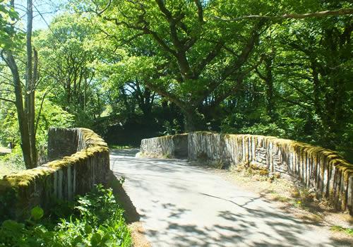 Photo Gallery Image - Bickham Bridge dates back to the 16th or early 17th Century